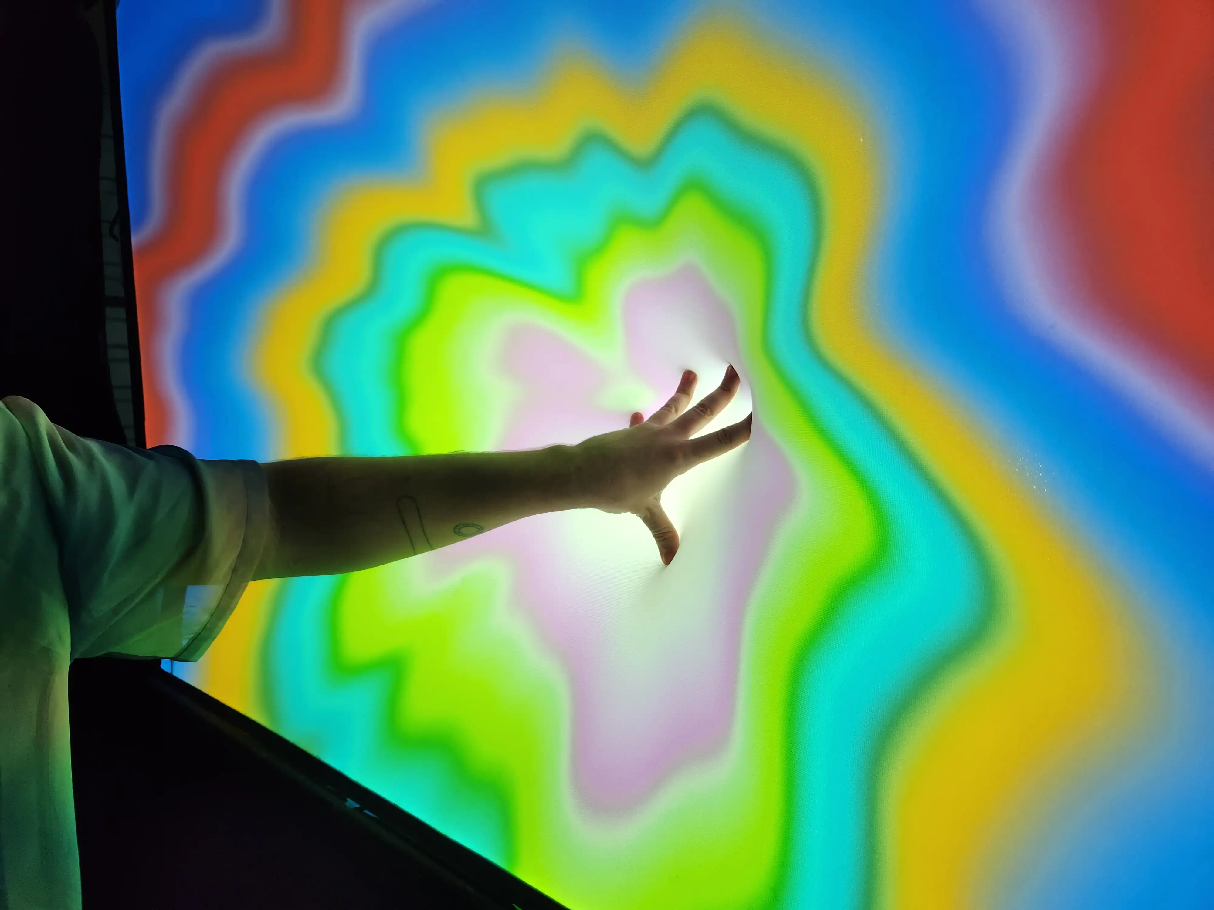 person hand touching digital art